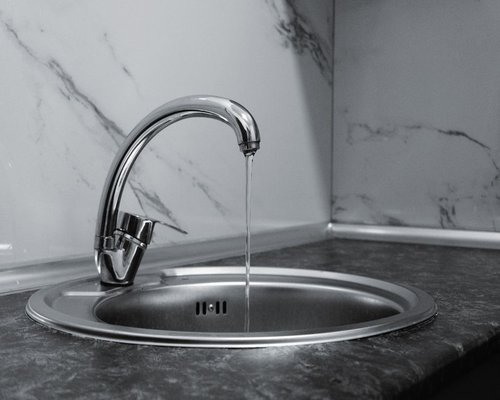 water and clean kitchen surface